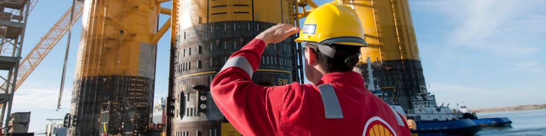 Engineer looking up at platform under construction